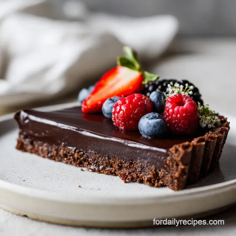 A slice of deep chocolate dessert artfully arranged with a swirl of cream and fresh raspberries.