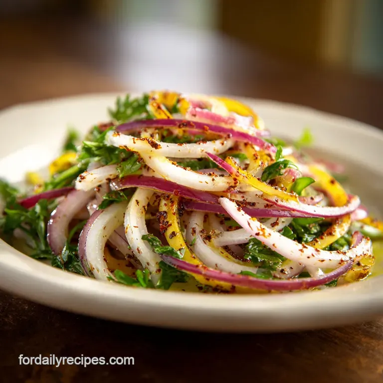 Heaped mound of ruby-red onion salad with a delicate sheen, nestled on a white plate. Green herbs add a pop of freshness.